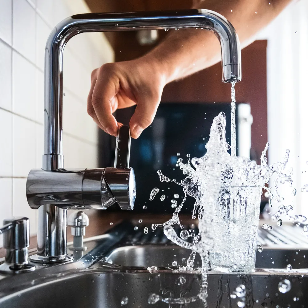 Find a local plumber Water running from a kitchen tap